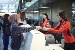 AirAsia Guest Services staff at check-in counter