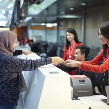 AirAsia Guest Services staff at check-in counter