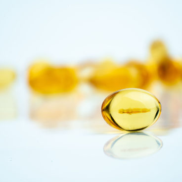 omega3 capsules on white background